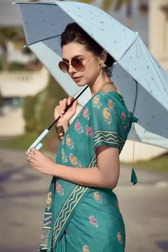 Women's turquoise silk blend printed saree with unstitched blouse piece