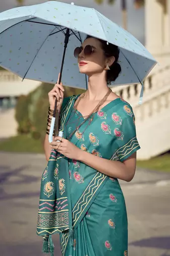 Women's turquoise silk blend printed saree with unstitched blouse piece
