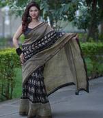 Black maheshwari silk blend saree with buti and checks on bottom and pallu