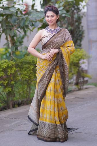 Yellow maheshwari silk blend saree with buti and checks on bottom and pallu