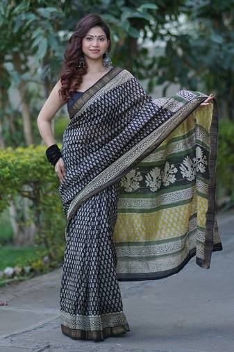 Black maheshwari silk blend saree with white butis and copper border