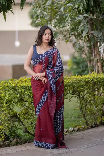 Maroon kota doria saree with blue ajrakh applique border and work on pallu