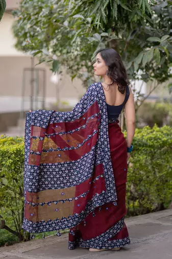 Maroon kota doria saree with blue ajrakh applique border and work on pallu