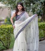 Offwhite kota doria saree with ajrakh border and black mirrorwork