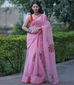 Pink kota doria applique saree with red ajrakh thin border and floral