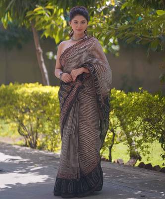 Cream kota doria saree with black stripes, black border and pallu 1