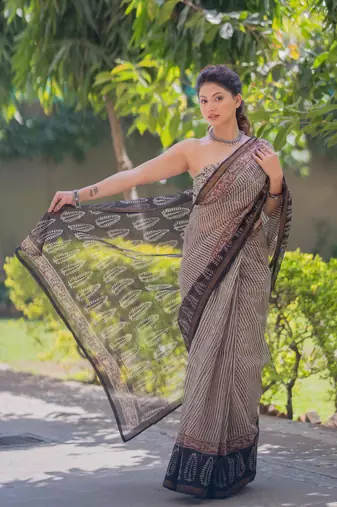 Cream kota doria saree with black stripes, black border and pallu