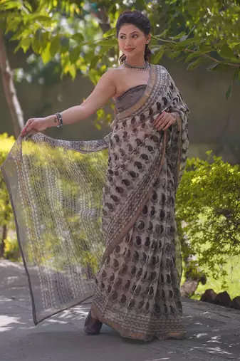 Cream kota doria saree with black buti print