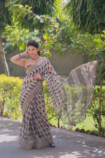 Cream kota doria saree with black buti print