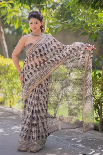 Cream kota doria saree with black buti print