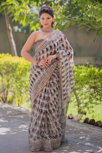 Cream kota doria saree with black buti print