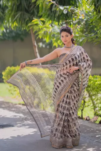 Cream kota doria saree with black buti print