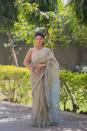 Light yellow kota doria sarees with floral prints , blue border and pallu