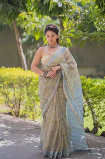 Light yellow kota doria sarees with floral prints , blue border and pallu