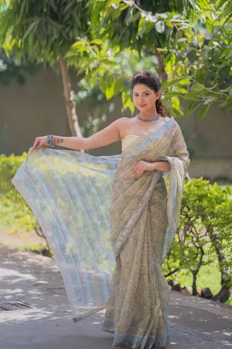 Light yellow kota doria sarees with floral prints , blue border and pallu