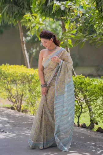Light yellow kota doria sarees with floral prints , blue border and pallu