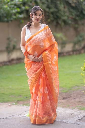 Orange kota doria saree with white block prints