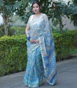 Light blue floral print kota doria saree with stripes on pallu