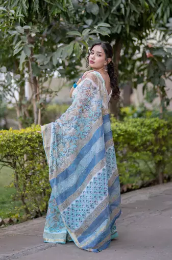 Light blue floral print kota doria saree with stripes on pallu