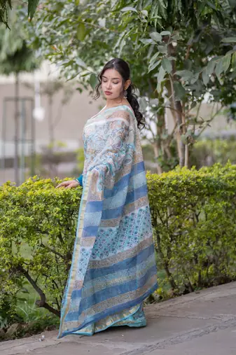 Light blue floral print kota doria saree with stripes on pallu