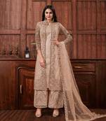 Beige net heavy embroidery semi stitched wedding suit
