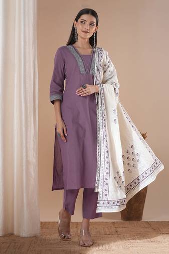 A 3-piece block printed kurta suit set with lace detail and block printed dupatta.