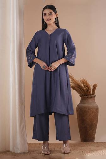 Panneled a line kurta with embroidery paired with lined palazzo in silk blend fabric.