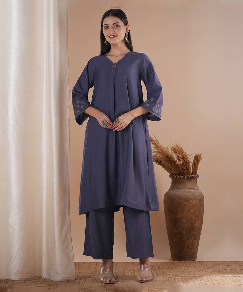 Panneled a line kurta with embroidery paired with lined palazzo in silk blend fabric.
