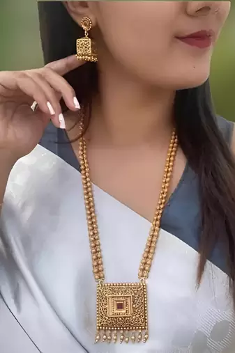 Antique gold-plated filigree necklace set – traditional long haram with ruby accent