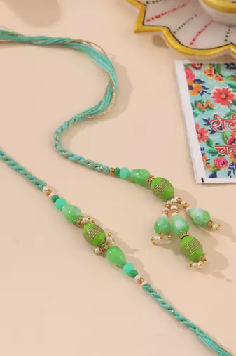 set of 2 green artificial beads bhaiya bhabhi rakhi with roli chawal chandan & mishri