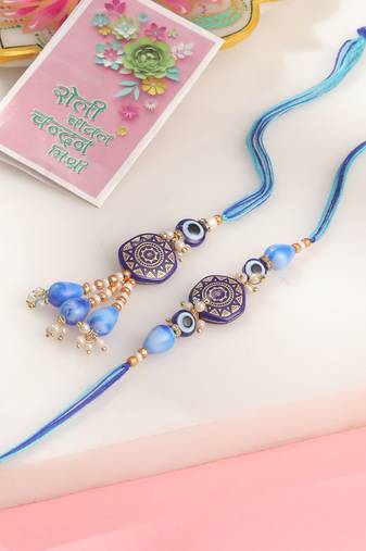 evil eye set of 2 blue artificial beads bhaiya bhabhi rakhi with roli chawal chandan & mishri