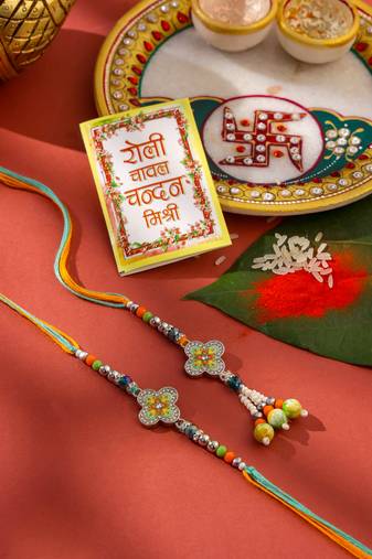 set of 2 multicolor artificial stones & beads floral bhaiya bhabhi rakhi with roli chawal chandan & mishri