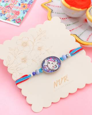 men red & blue ganesh ji thread rakhi with roli chawal chandan & mishri 1