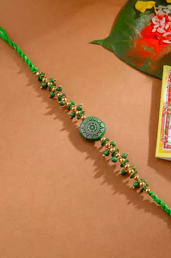 men green artificial beads round shape thread rakhi with roli chawal chandan & mishri
