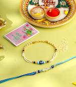 set of 2 blue evil eye artificial stones & beads bhaiya bhabhi rakhi with roli chawal chandan & mishri