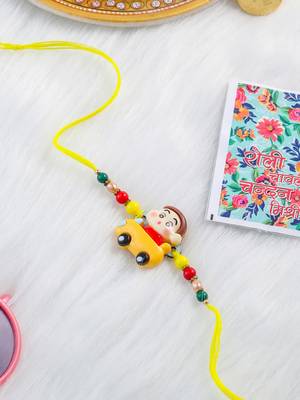 kids yellow cartoon artificial beads rakhi with roli chawal chandan & mishri 2