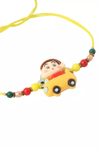kids yellow cartoon artificial beads rakhi with roli chawal chandan & mishri
