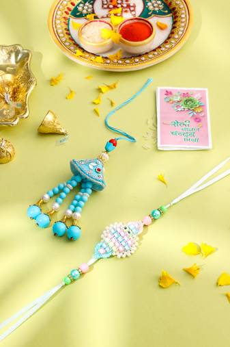 set of 2 blue & pink artificial stones & beads bhaiya bhabhi rakhi with roli chawal chandan & mishri