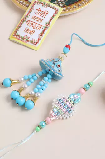 set of 2 blue & pink artificial stones & beads bhaiya bhabhi rakhi with roli chawal chandan & mishri