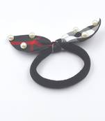 Viaana checks print ears rubber band with attached pearls black color
