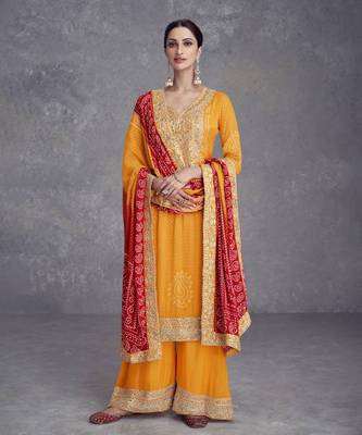 Yellow heavy gota & mirrow wrok bandhani silk suits 1