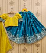 Royal lehenga set in rama blue & yellow