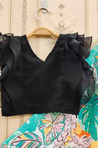 Stylish floral lehenga with black ruffle blouse