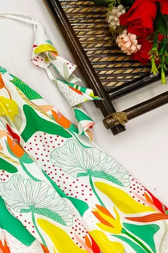 Vibrant floral lehenga with yellow ruffle top