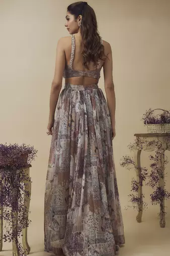 Printed lurex chiffon hand embroidered bustier along with asymetric gathered skirt and embroidered net dupatta