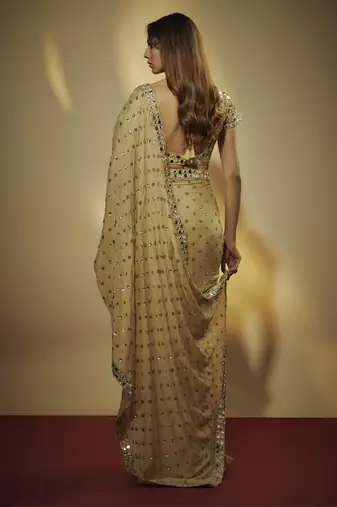 Gold pre drapped chinnon chiffon sequins saree with mirror and sequins hand embroidery.