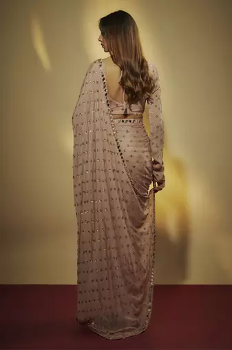 Mauve chinnon chiffon sequins pre drapped saree with mirror lace along with sequins full sleevs blouse