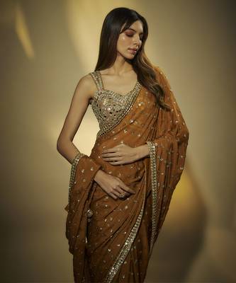 Copper chinnon chiffon sequins and mirror embroidered saree with mirror embroidered bustier . 3