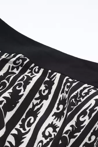 Black arabesq printed pleated skirt by label ritu kumar