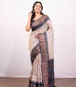 Offwhite and black pure handloom tussar silk saree with golden zari border pallu